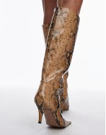 snake print knee high heeled boots in grey
