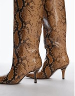 snake print knee high heeled boots in grey