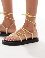 leg tie flat sandals in yellow leather