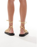 leg tie flat sandals in yellow leather