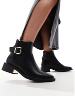 ‌Stylish ankle boots with buckle details in black