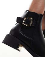 ‌Stylish ankle boots with buckle details in black
